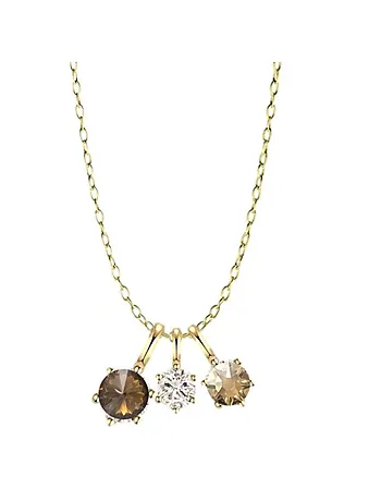 Noctelle smykke i forgylt messing med champagnefarget zirkonia