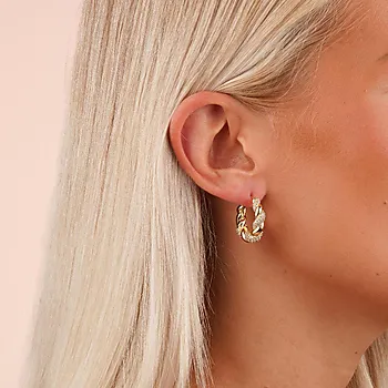 Bilde nummer 2 av Twist øreringer i forgylt messing med zirkonia