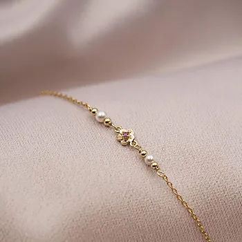 Bilde nummer 2 av Armbånd til barn i 925 forgylt sølv med blomst og perler