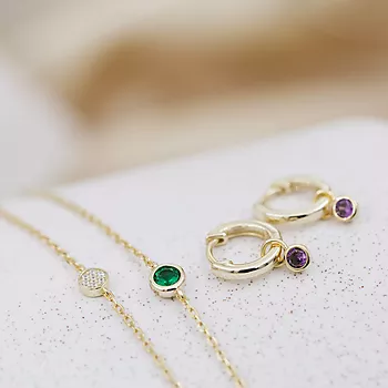 Bilde nummer 2 av Pan Jewelry, Øreringer i 925 forgylt sølv med lilla zirkonia